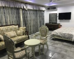 Living room and bedroom interior at Renocks Apartment