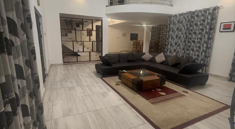 Living room lounge area at Carl’s Villa Apartments