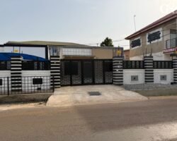 Exterior gated entrance of Divine Space Spintex