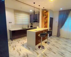 Modern kitchen with breakfast bar at Divine Space Tse Addo