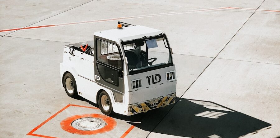 white and black truck on gray concrete floor